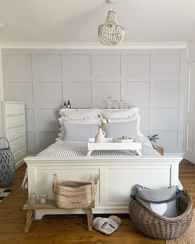 Light grey bedroom with headboard wall panels